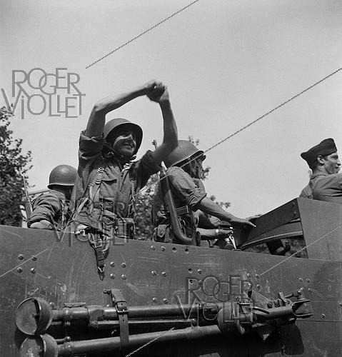 World War II. Liberation of Paris. Parade of tanks from the 2nd Armored Division commanded by General Leclerc. The Langlade Tactical Group on the Champs-Elysées. Paris (8th arrondissement), on August 26, 1944. Photograph by Jean Roubier (1896-1981).